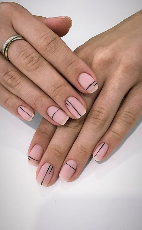 Nude manicure with stripes and lines