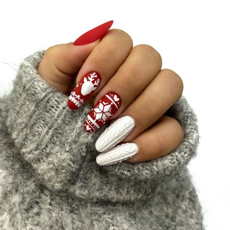 Ideas de manicura roja para el invierno Los motivos navideños bellamente ilustrados en las yemas de los dedos en rojo alegrarán su manicura de invierno.