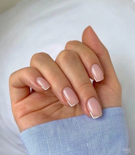 Photo of a beautiful French manicure for short nails