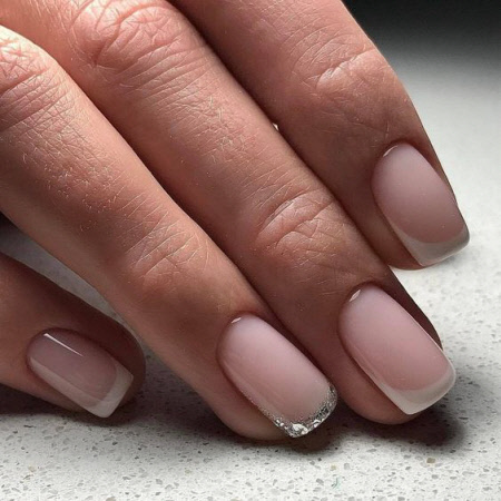 Photo of a beautiful French manicure for short nails