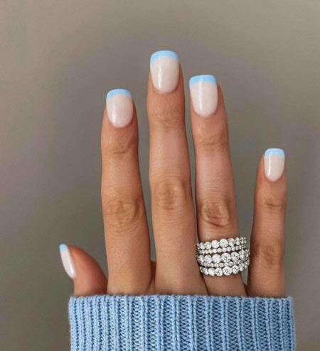Photo of a beautiful and delicate French manicure